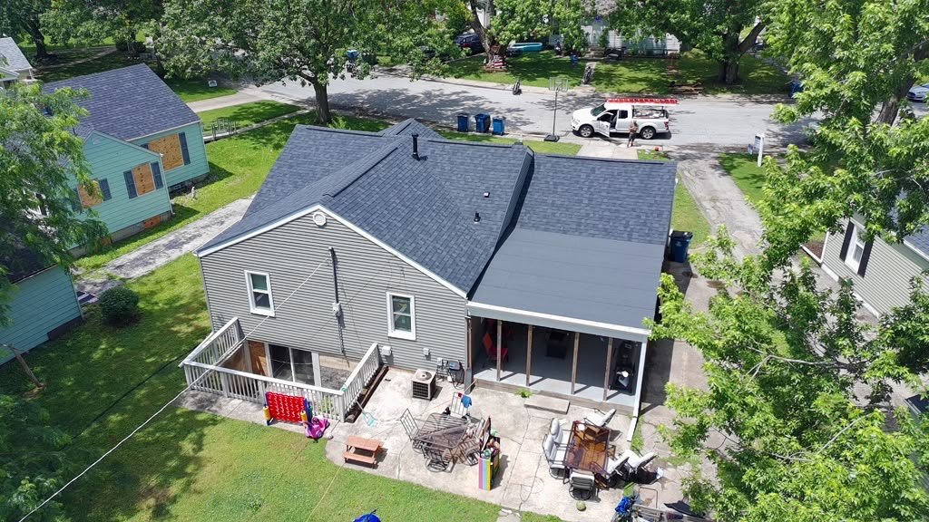 An Eagle Star roof replacement on a Chicagoland home with the crew truck parked at the curb